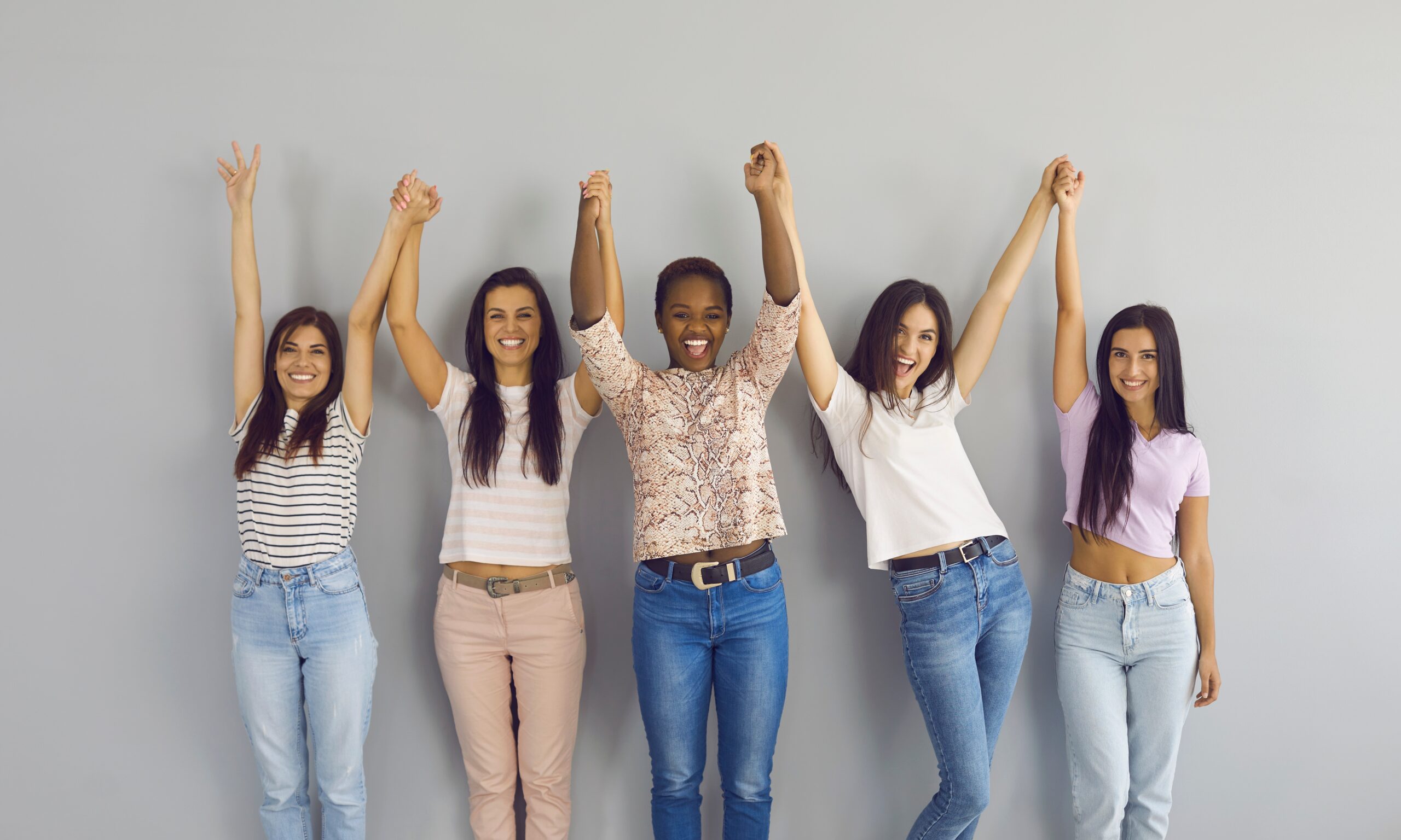 Group,Portrait,Of,Positive,Confident,Diverse,Ladies,Holding,Hands.,Team